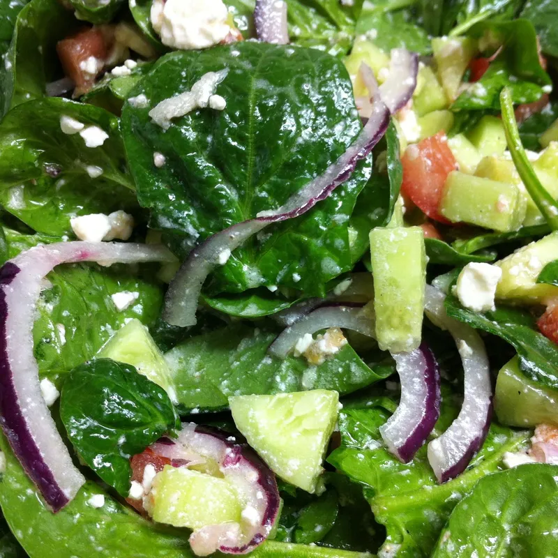 Greek spinach salad bowl