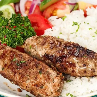 Lamb and Beef Kofta, herbed rice with lentils and Sumac roasted vegetables