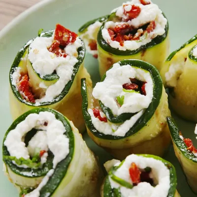 Zucchini roll ups with lemon ricotta and roasted pepper sauce