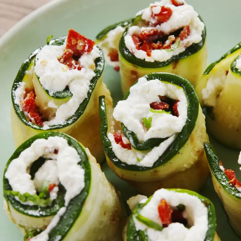 Zucchini roll ups with lemon ricotta and roasted pepper sauce (30 pieces — Servings: 11-14)